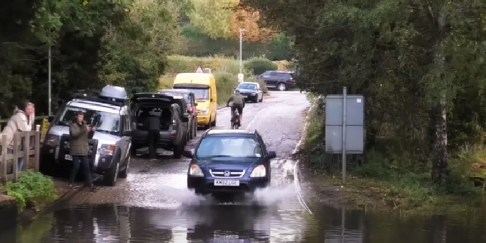 Honda CRV driving through floodwater too fast