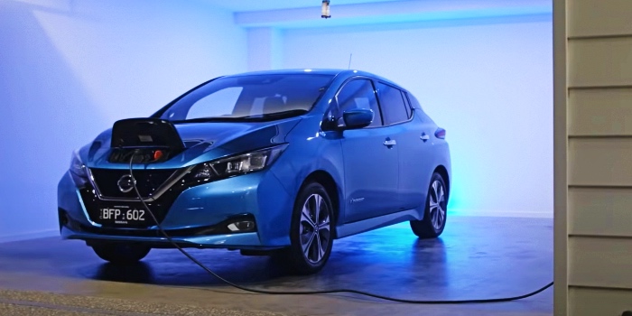 Nissan Leaf charging at home in garage.