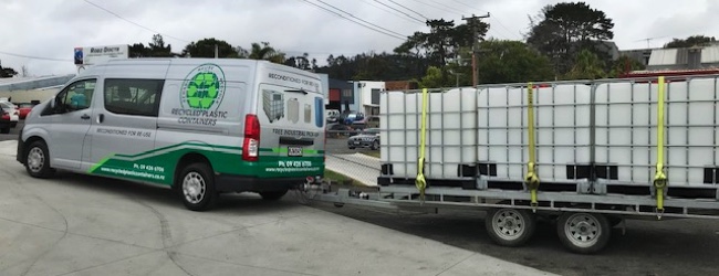 Billie's flat deck trailer loaded up with 1,000 litre IBC recycled plastic containers.